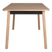 Light wood table with a sleek black drawer, featuring a minimalist design and smooth finish. Ideal for modern interiors.