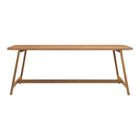 Light oak wood dining table with a smooth, plain surface and angled legs, showcasing natural wood grain patterns.