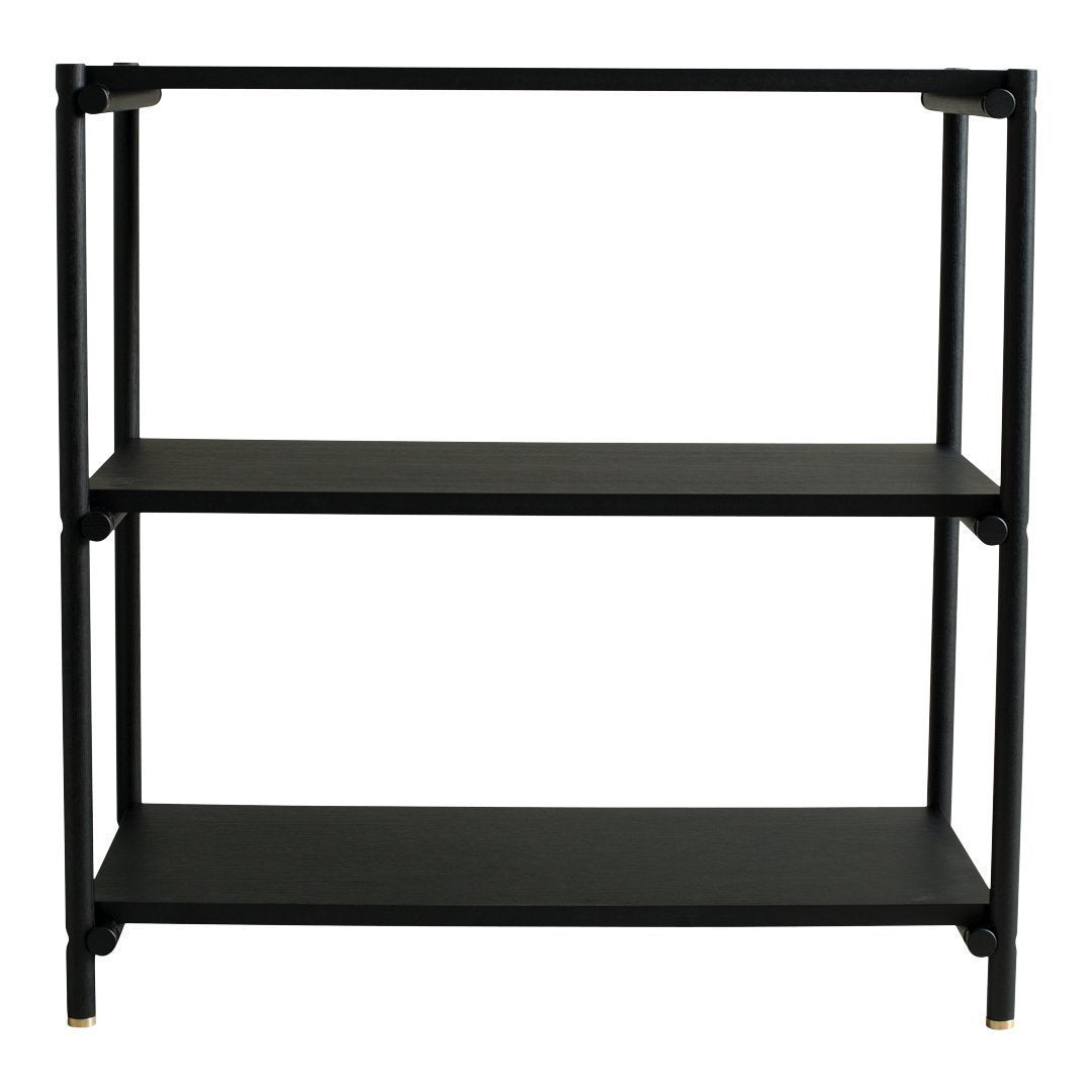 Black metal shelving unit with two shelves, featuring a sleek modern design and gold accents on the legs.