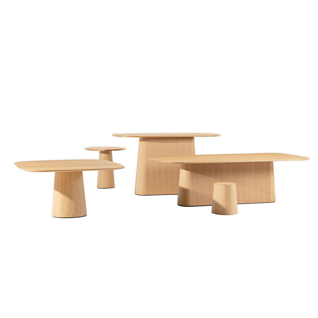 Set of three light wood tables showcasing minimalistic design and smooth, natural grain patterns.