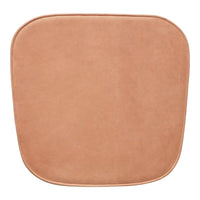 Soft, smooth, square cushion in warm tan with rounded edges, perfect for any modern decor.