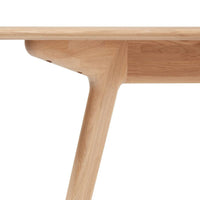 Natural wood tabletop with a light oak finish and smooth, minimalist curves, complemented by clean, sharp edges.