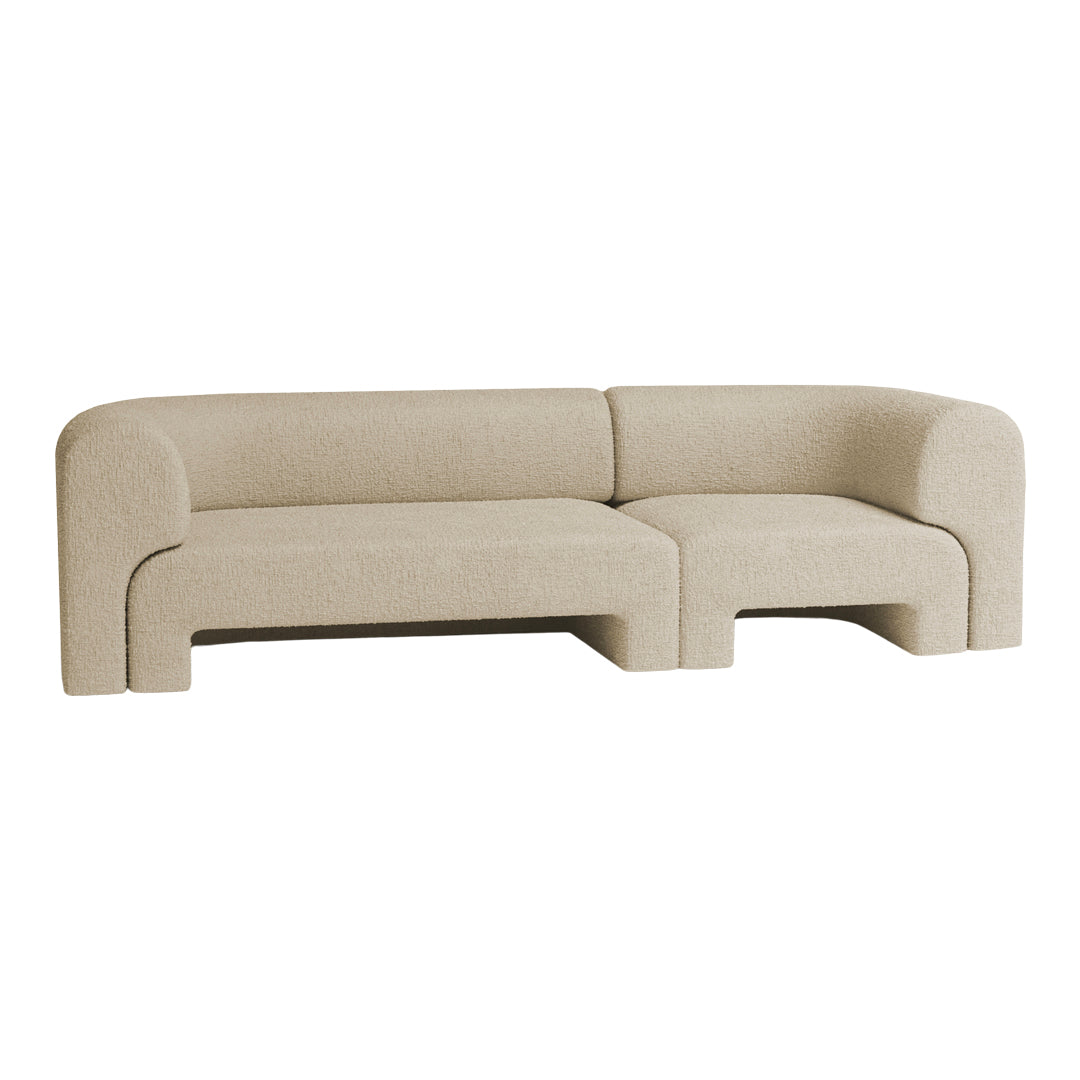 Beige textured sofa with a modern, curved design, perfectly blending comfort and style for any living space.
