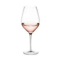 Elegant wine glass filled with light pink rosé, featuring a clear glass design for enhanced presentation.