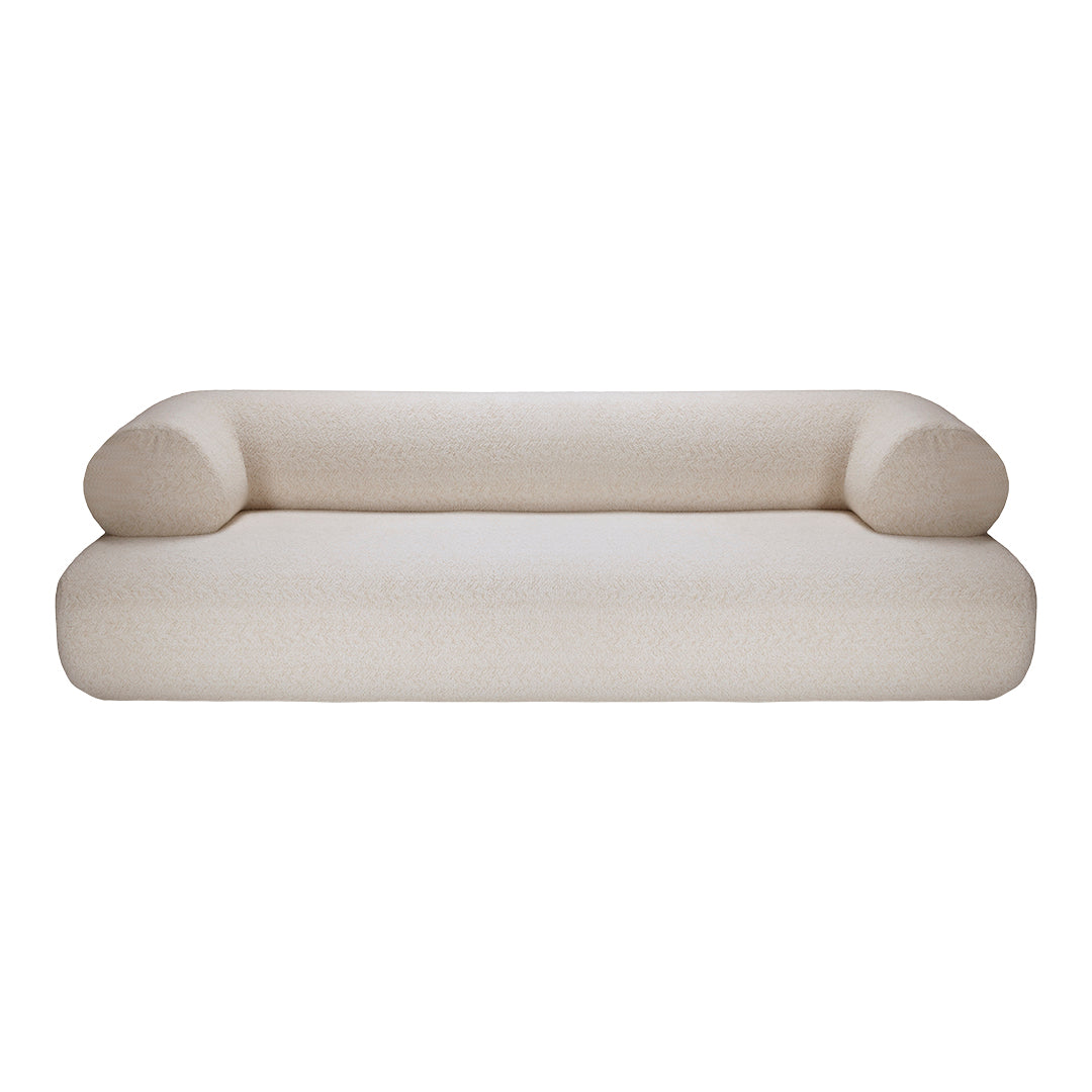 Cozy cream sofa with soft texture and rounded armrests, perfect for modern living spaces.