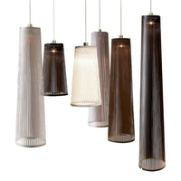Textured pendant lights in muted tones of white, gray, and brown with vertical ribbed patterns. Stylish and modern design.