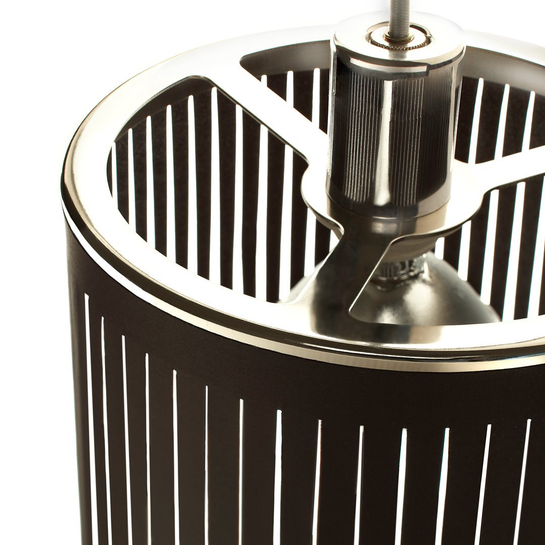 Black cylindrical lamp with vertical silver stripes and metallic accents. Modern, sleek design for contemporary decor.