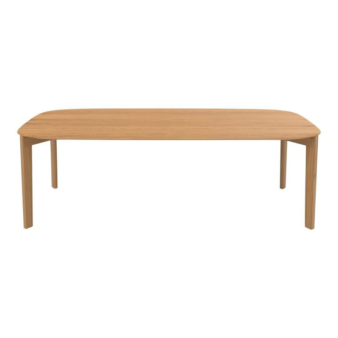 Light wooden dining table with a natural finish and smooth, rounded edges, perfect for modern dining spaces.