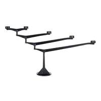 Black candle holder with sleek, modern design featuring four arms and a stylish base. Perfect for contemporary decor.