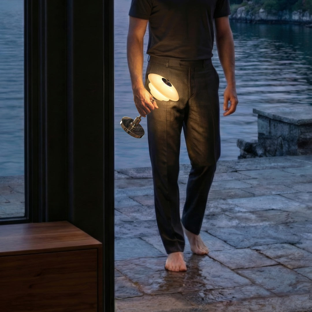 "Dark green patterned pants with a sleek design, showcasing a minimalist lamp against a tranquil water background."