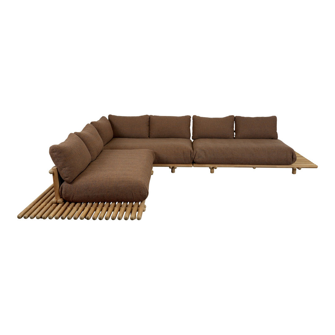 Brown sectional sofa with plush cushions, featuring a modern design on a bamboo slatted base.