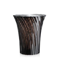 Stylish black decorative vase with vertical ribbed pattern and smooth glossy finish. Ideal for modern interiors.