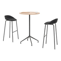 Stylish black bar stools paired with a natural wood and black table, creating a modern minimalist look.