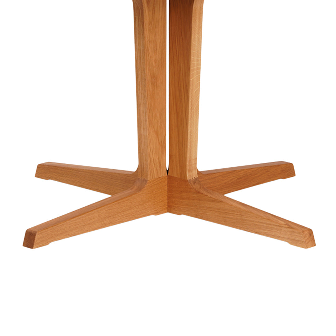 Natural wood grain table base in light oak finish, showcasing a sleek, modern, minimalist design.