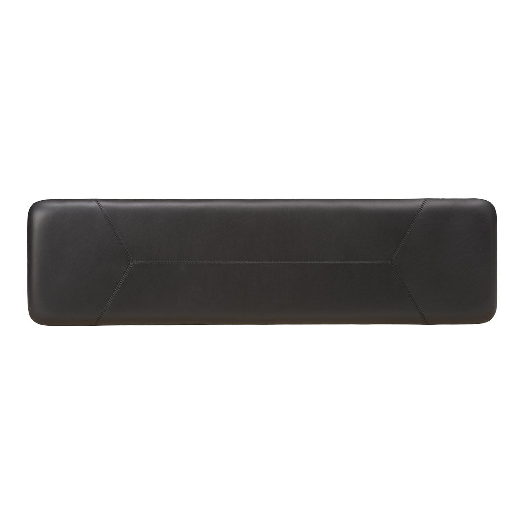 Sleek black leather bench with a smooth surface and minimalist geometric pattern, perfect for modern decor.