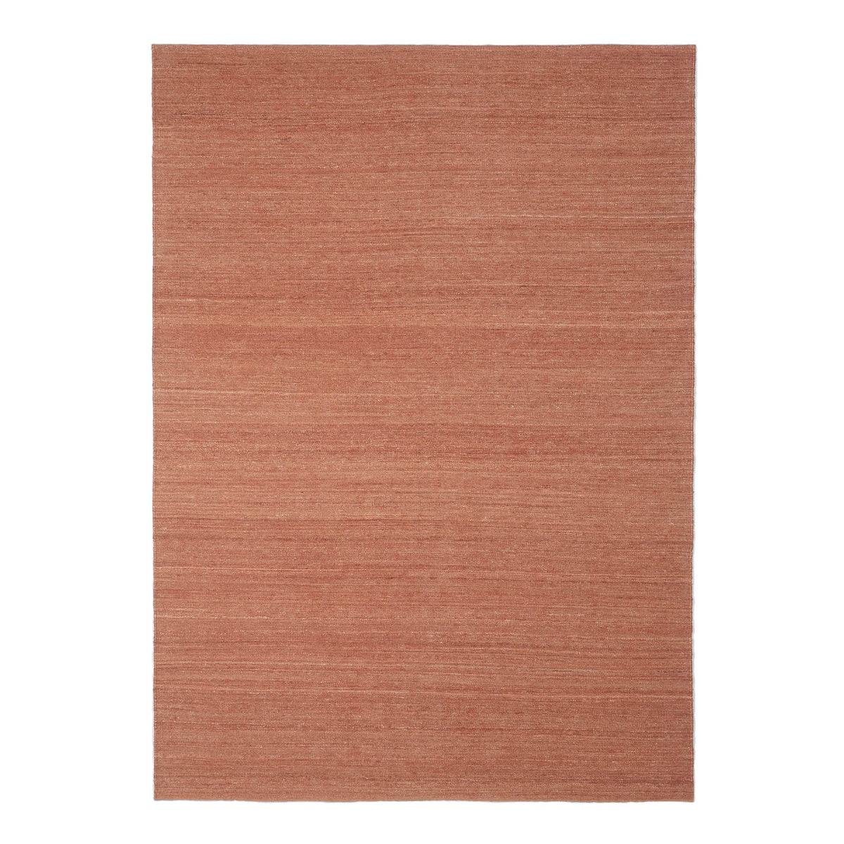 Textured area rug in warm terracotta color with subtle striations for a modern, cozy look. Perfect for home decor.