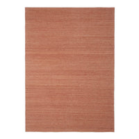 Textured area rug in warm terracotta color with subtle striations for a modern, cozy look. Perfect for home decor.