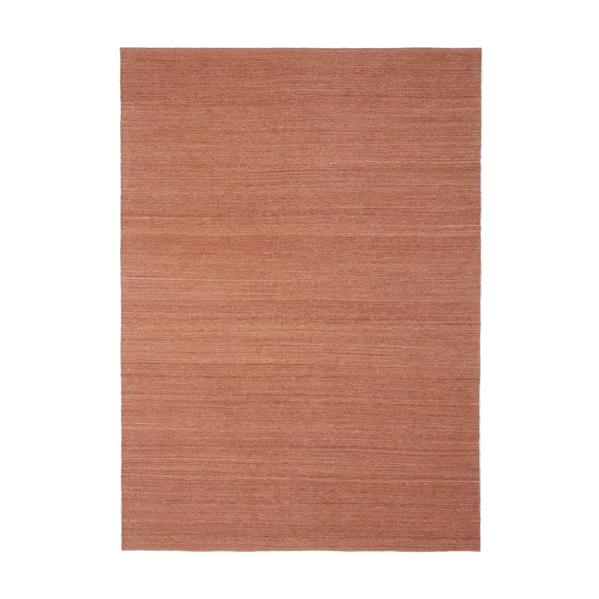 Rust-colored area rug with subtle texture and a solid design, perfect for modern and minimalist decor.