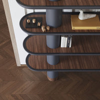 Modern bookshelf featuring dark wood tones, smooth gray accents, and sleek, curved lines for a stylish look.