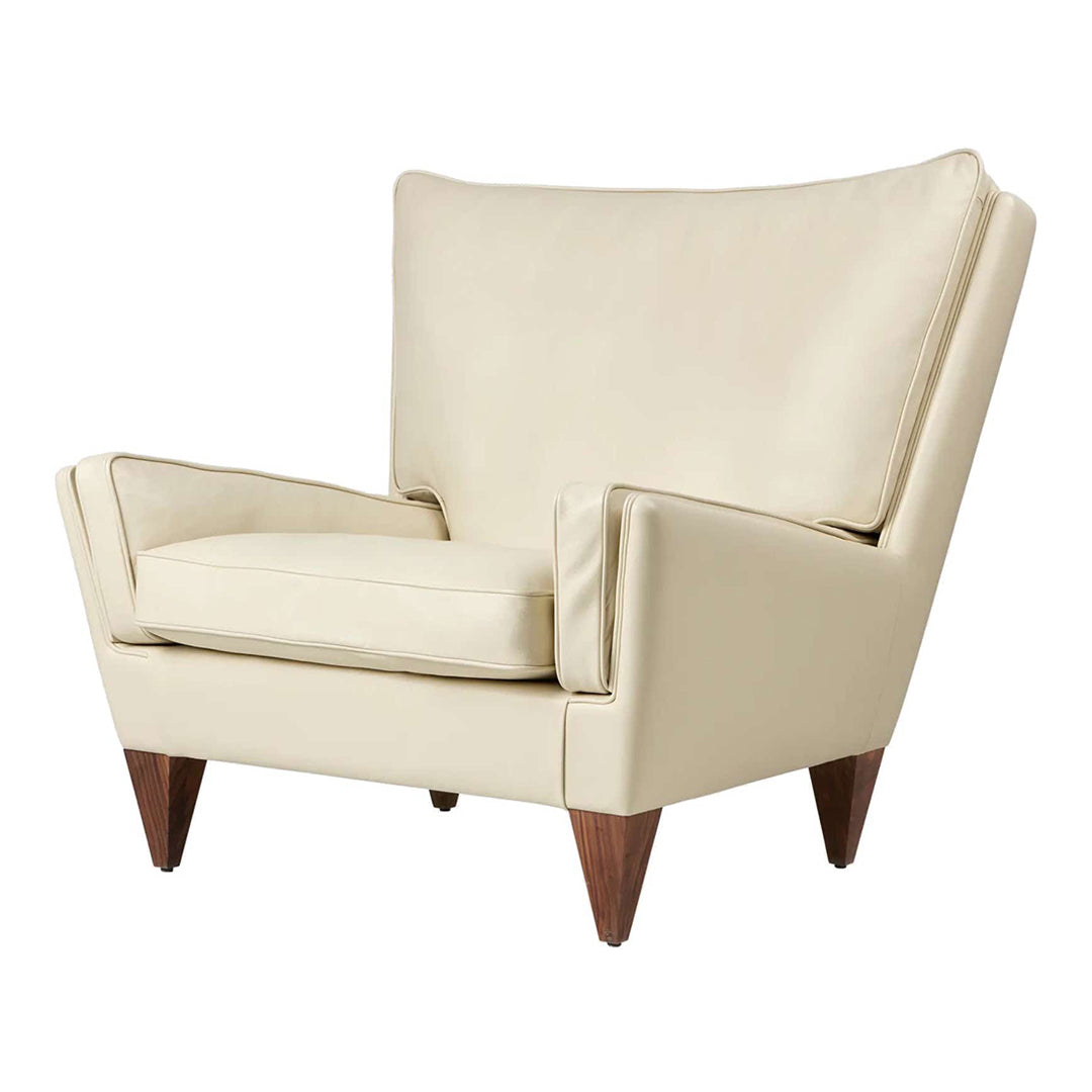 Beige leather accent chair with a smooth finish and dark wooden legs, featuring a mid-century modern design.