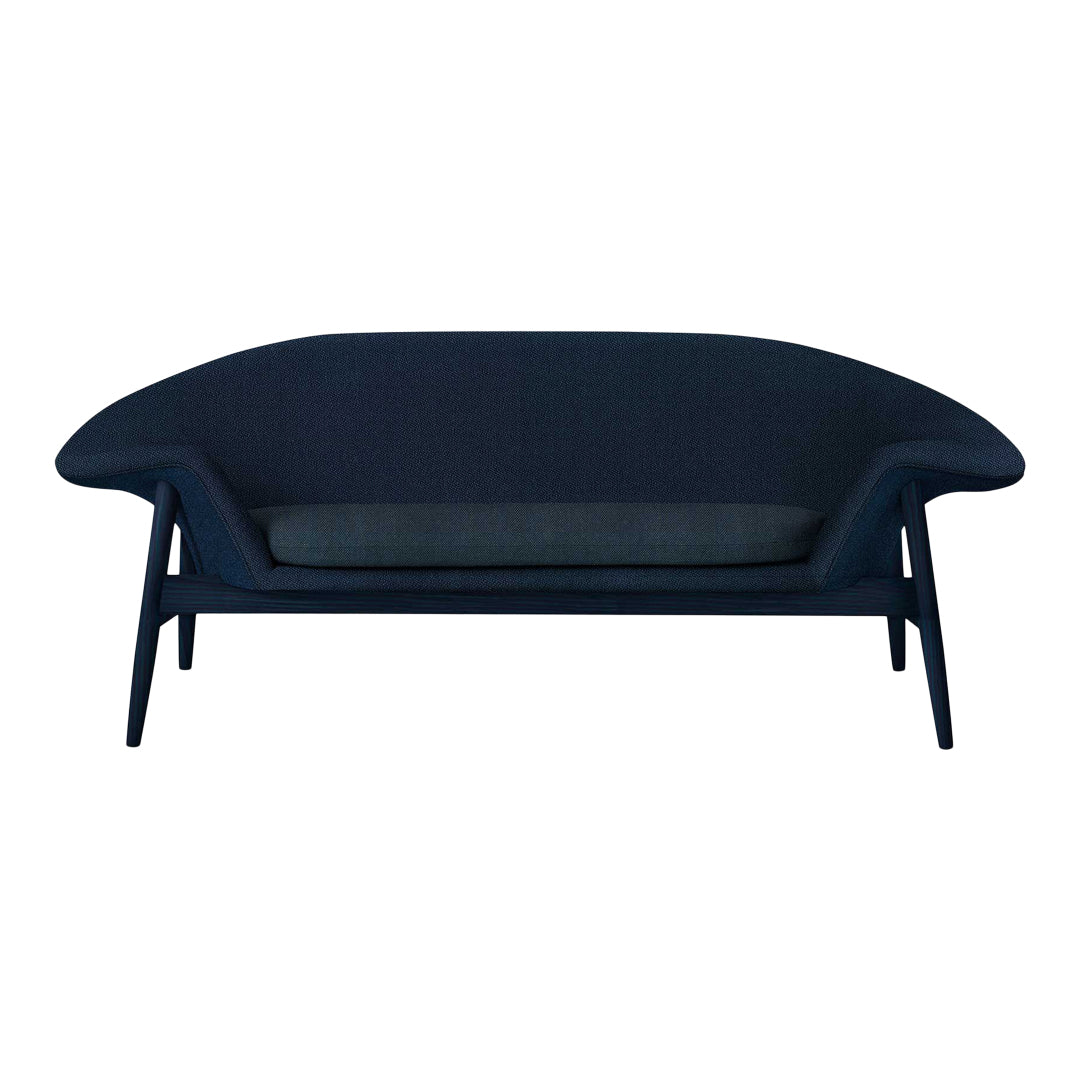 Dark navy blue modern sofa with sleek lines and a simple, minimalist design. Featuring a smooth texture.
