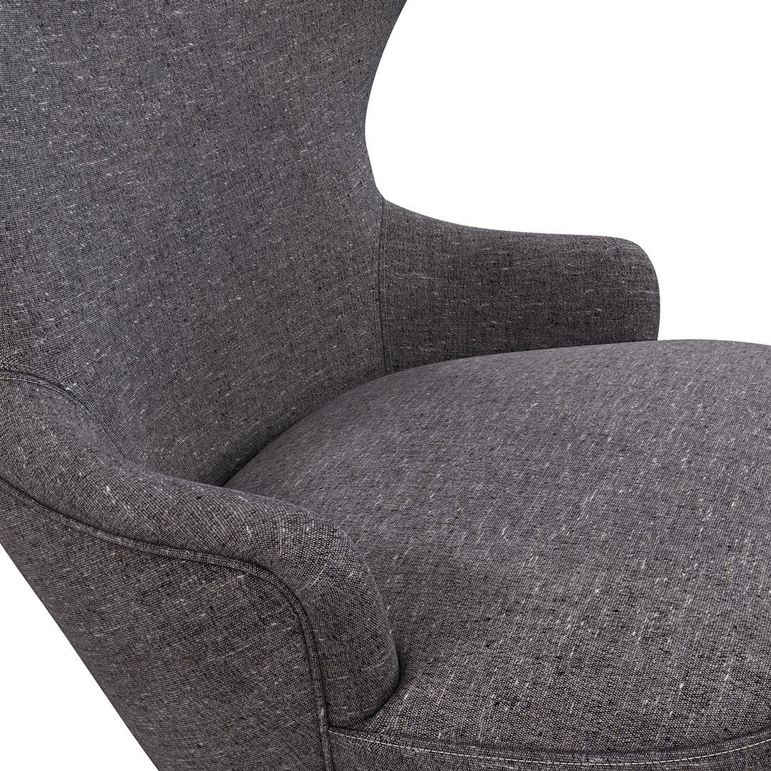 Gray upholstered chair with a sleek, textured pattern, perfect for modern living spaces.