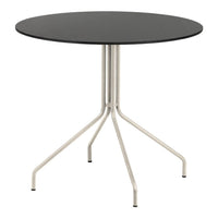 Round black table with a sleek silver base, featuring a minimalist design and smooth finish. Perfect for modern spaces.