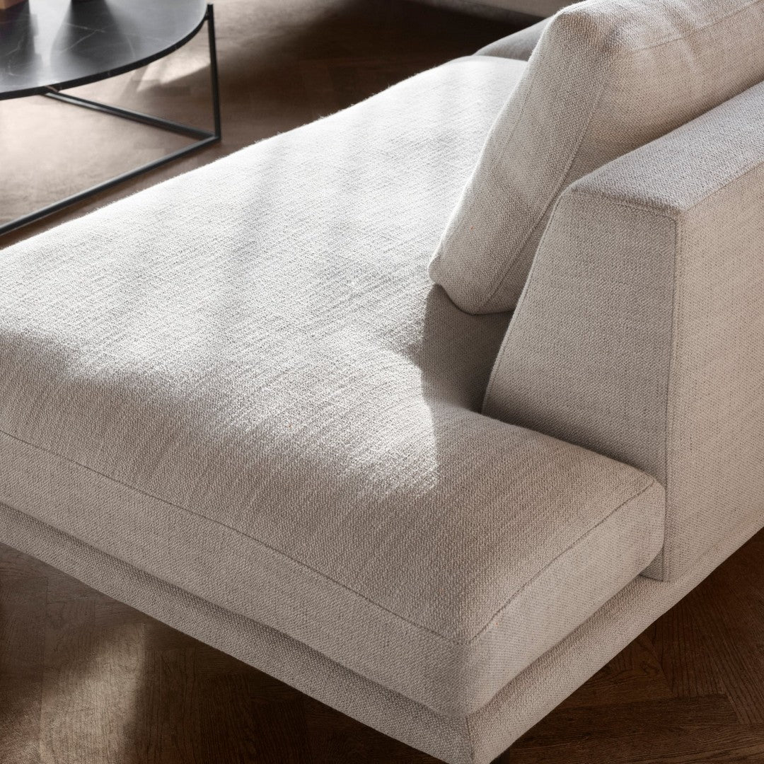 Light beige textured fabric sofa with clean lines and minimalistic design. Ideal for modern living spaces.
