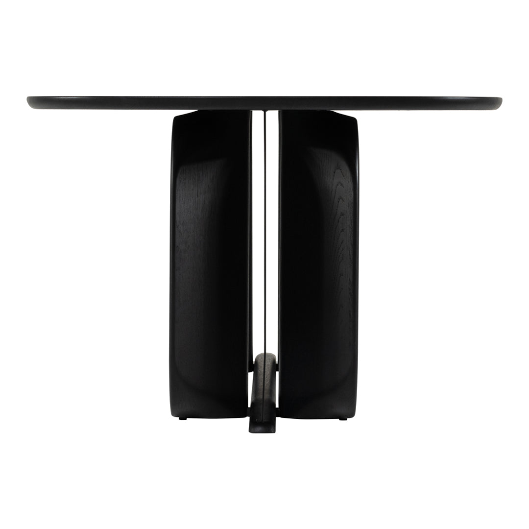 Black minimalist table with smooth surface and unique geometric base design. Modern and sleek aesthetic.
