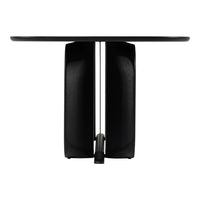 Black minimalist table with smooth surface and unique geometric base design. Modern and sleek aesthetic.
