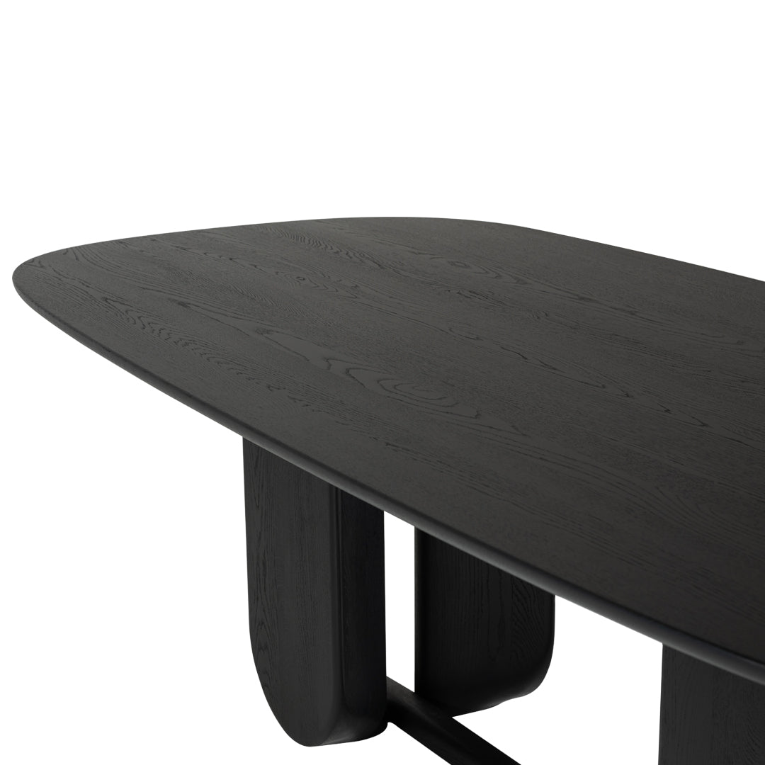 Black oval dining table with smooth finish and intricate wood grain pattern. Modern design for contemporary spaces.