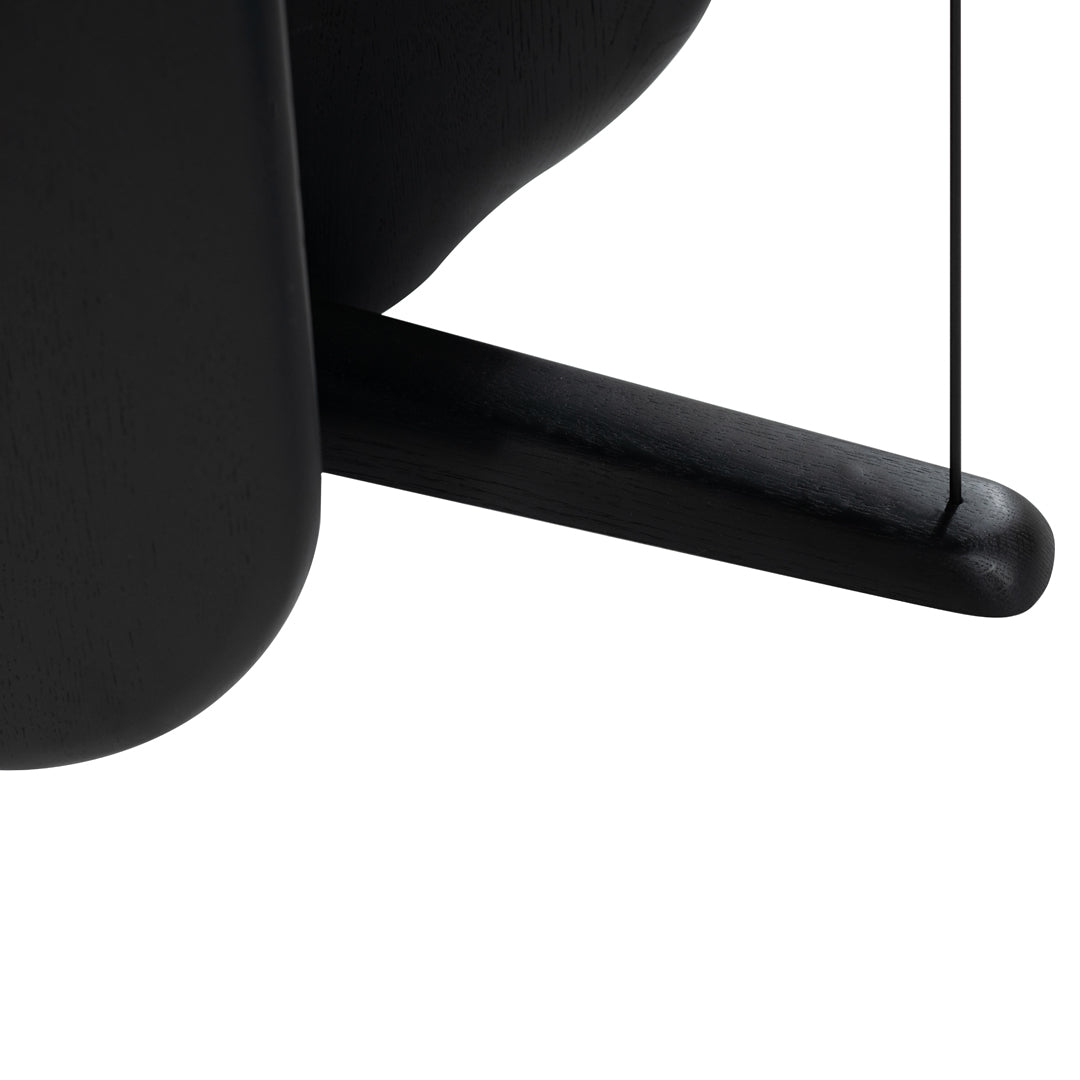"Close-up of sleek black curves and lines, showcasing a modern minimalist design."