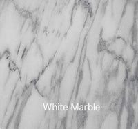 Alt text: "Elegant white marble with subtle gray veining, showcasing a smooth, polished surface."