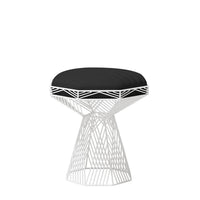 Black cushioned stool with a geometric white metal base design, perfect for modern decor.
