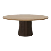 Round wooden dining table with a light oak top and a dark wood pedestal base, showcasing a sleek, modern design.