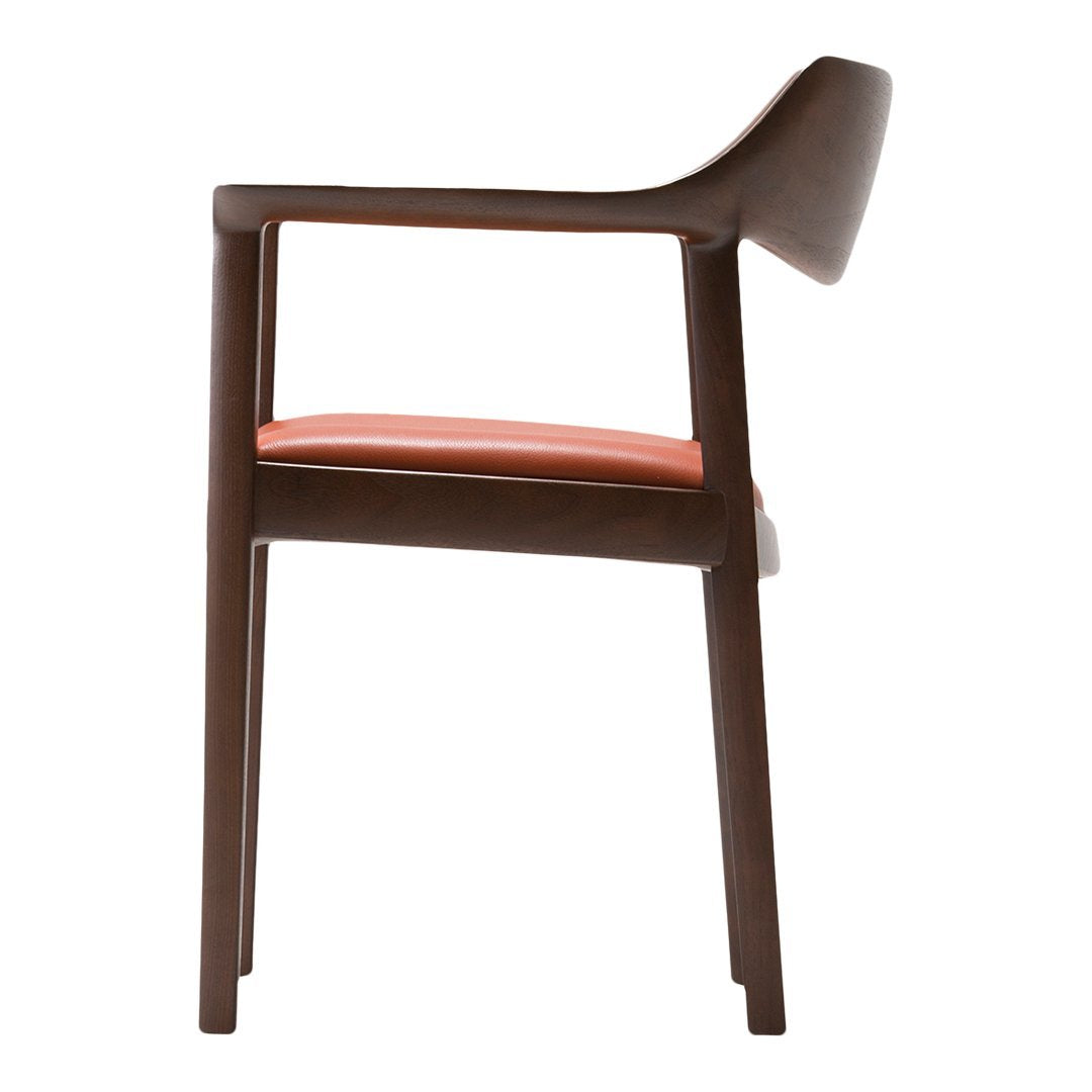 Brown wooden chair with a smooth finish and soft coral-colored cushion. Modern design with minimal patterns.
