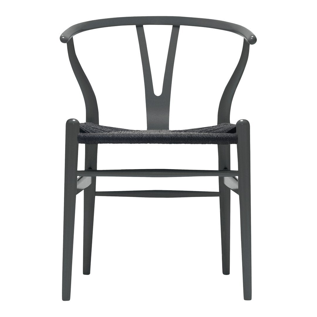 Gray wooden chair with a woven seat, featuring a sleek, minimalist design and subtle curves.