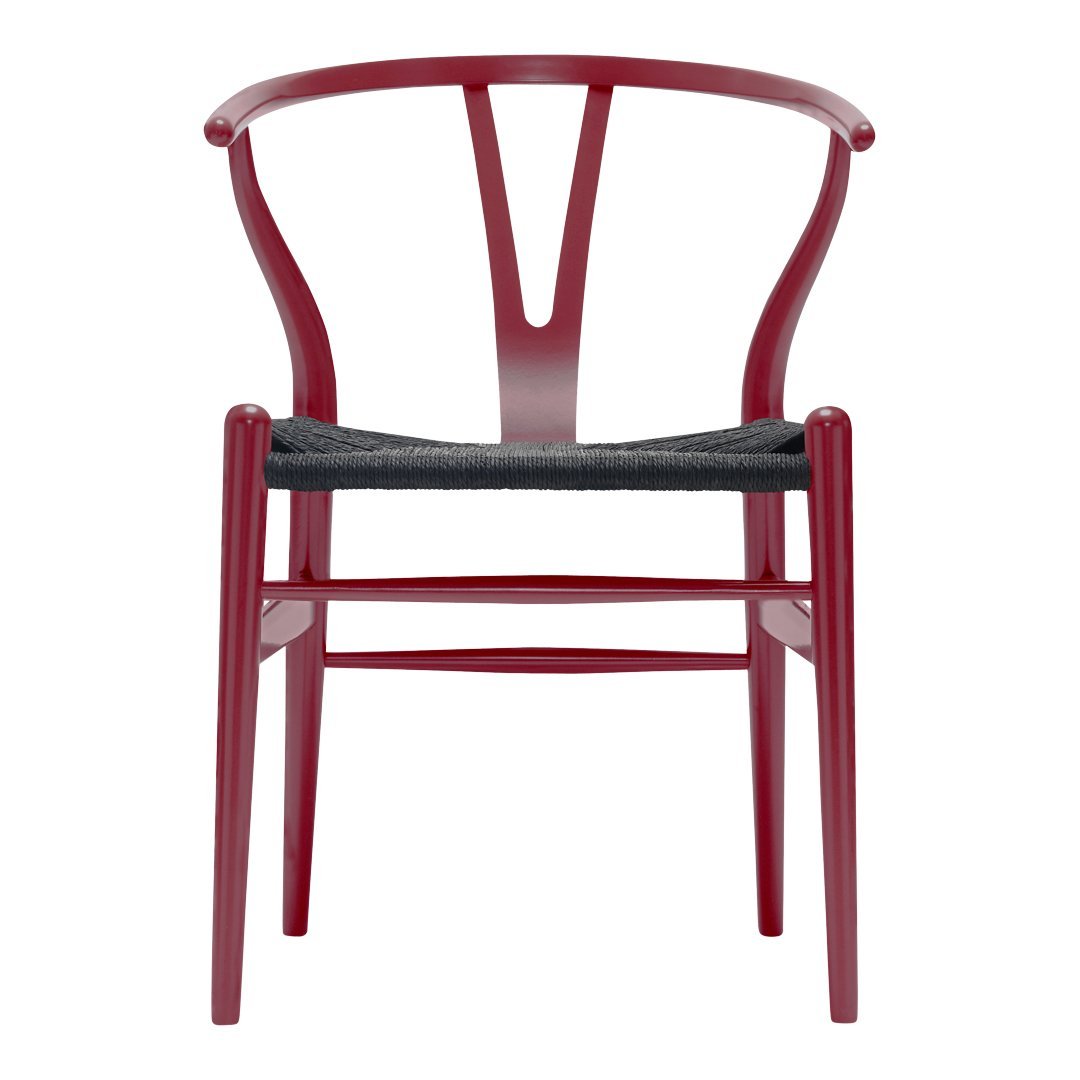 Red wooden chair with a sleek Y-shaped backrest and a dark woven seat cushion. Modern and stylish design.