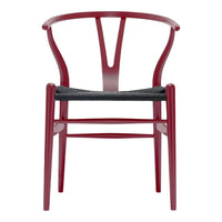 Red wooden chair with a sleek Y-shaped backrest and a dark woven seat cushion. Modern and stylish design.