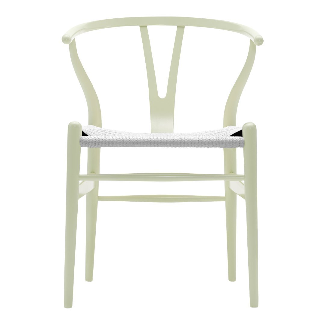 Light green chair with a minimalist design and a white seat, featuring a smooth surface and curved backrest.