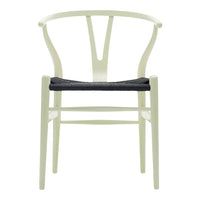 Light green chair with a sleek, minimalist design and a dark woven seat cushion. Perfect blend of color and texture.