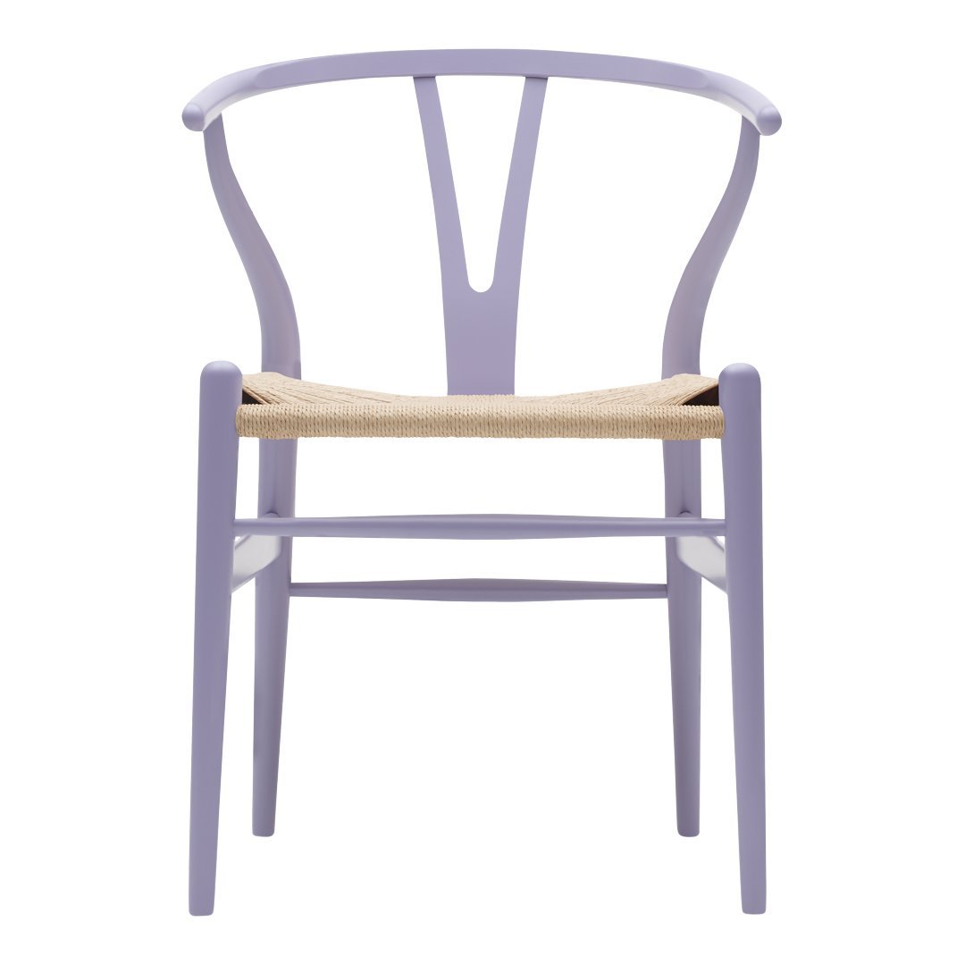 Lavender chair with a curved back and woven natural fiber seat, showcasing a modern and minimalist design.