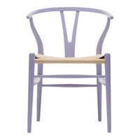 Lavender chair with a curved back and woven natural fiber seat, showcasing a modern and minimalist design.