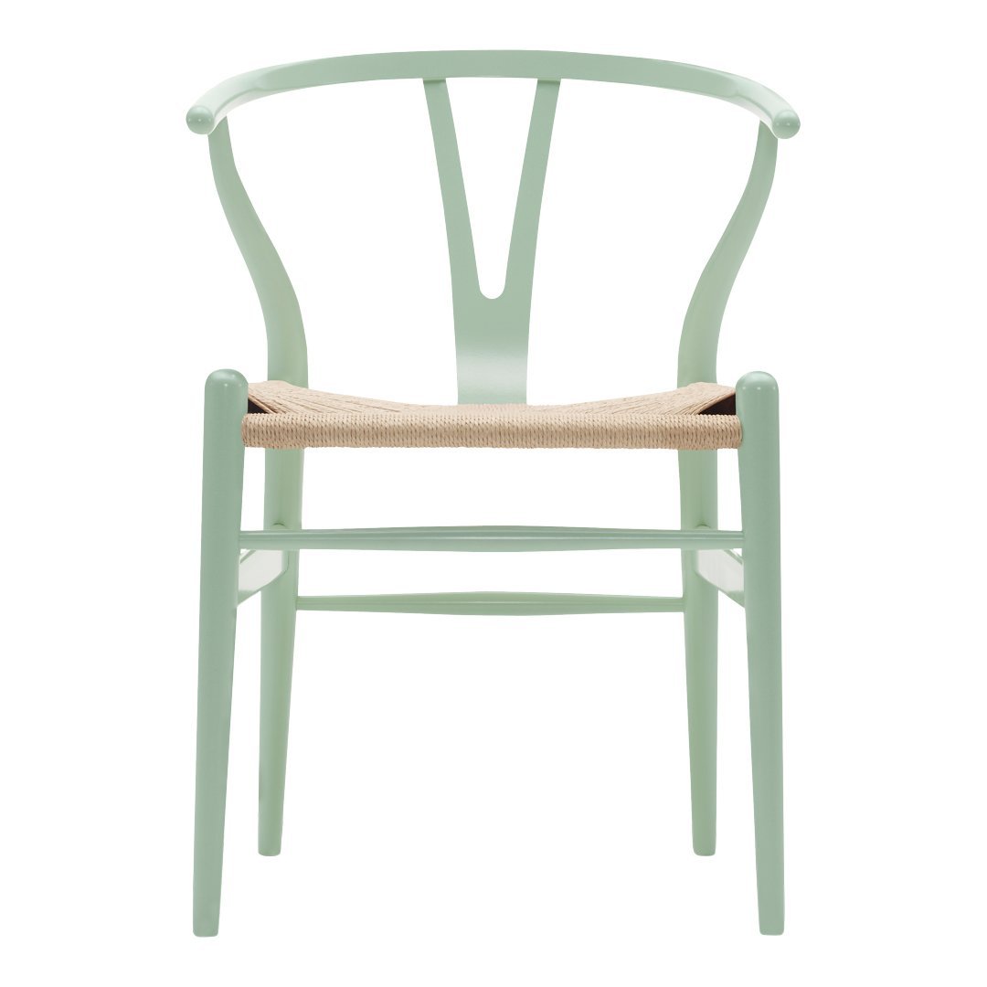 Mint green chair with a natural woven seat and minimalist design, featuring a classic, curved backrest.