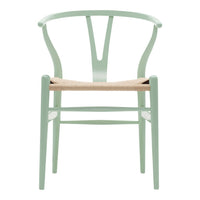 Mint green chair with a natural woven seat and minimalist design, featuring a classic, curved backrest.