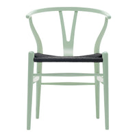Mint green chair with a minimalist design and dark woven seat. Modern color combination for stylish decor.