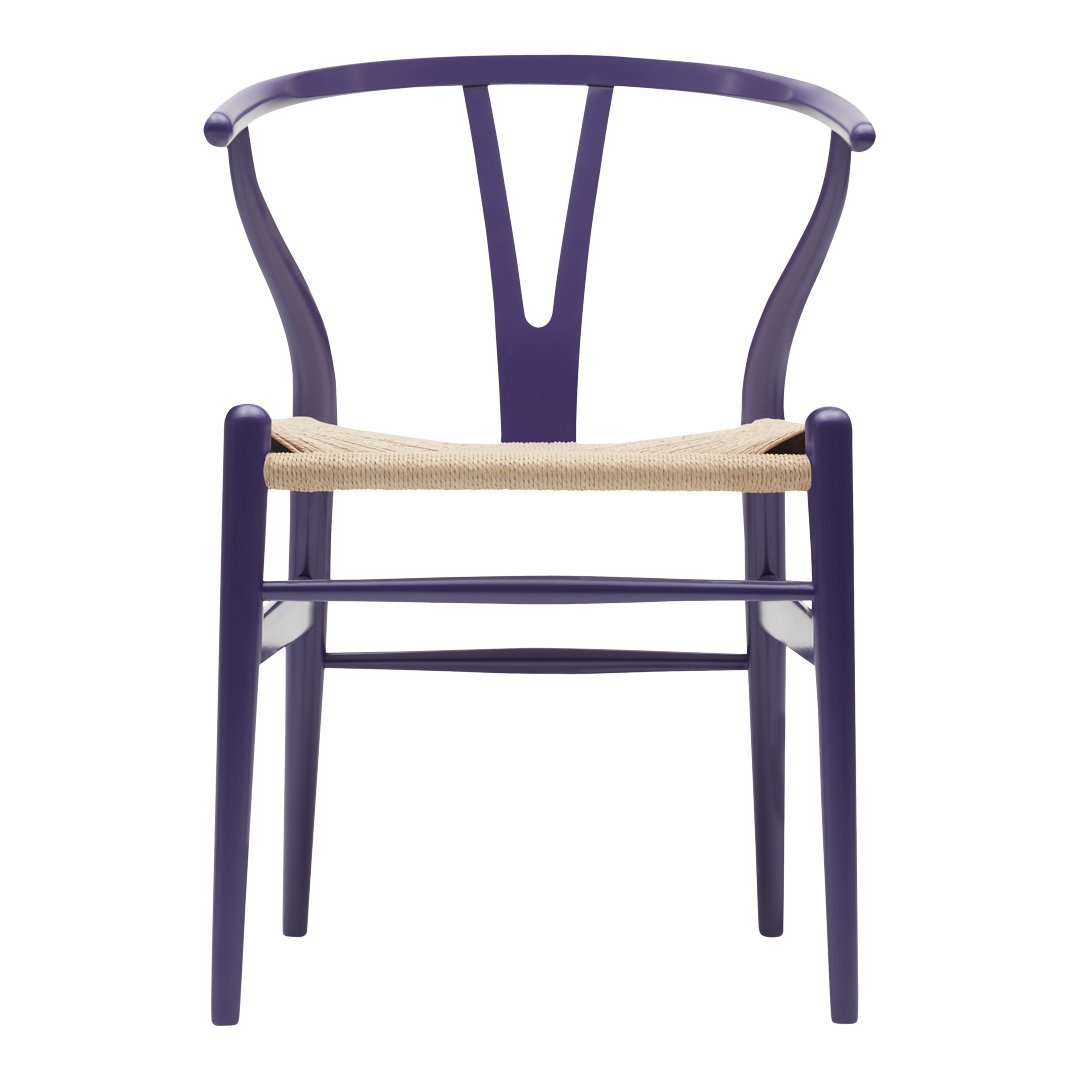 Purple wood chair with a natural woven seat, featuring a modern, minimalist design and elegant lines.