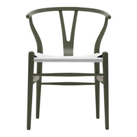 Olive green wooden chair with a white seat, featuring a minimalist design and elegant curved lines.