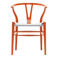 Orange wooden chair with a minimalist design and a white seat cushion, showcasing smooth curves and modern aesthetics.