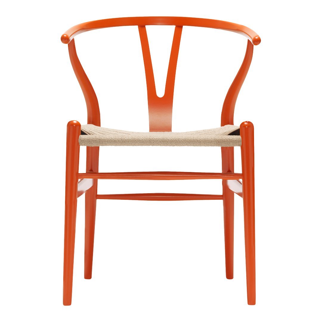 Vibrant orange wooden chair with a woven beige seat and elegant curvy design. Perfect for modern decor.
